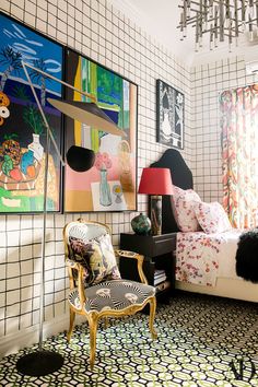 an instagramted photo of a bedroom with art on the walls and flooring