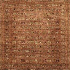 an orange and brown rug with many different colored designs on the bottom, including two rows of