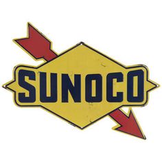 an old sunoco sign with arrows pointing in different directions