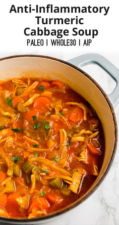 a close up of a bowl of soup with carrots