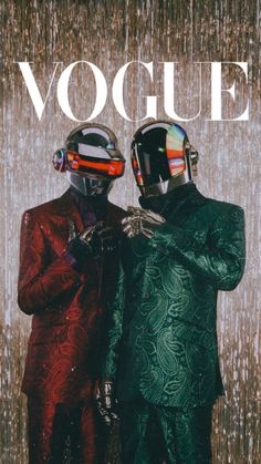 two men in suits and helmets standing next to each other with the words voque on them