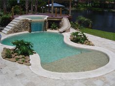 a small pool with a slide in the middle