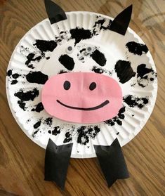 a paper plate with a cow face on it