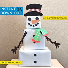 a snowman made out of paper sitting on top of a white box with the words instant and printable