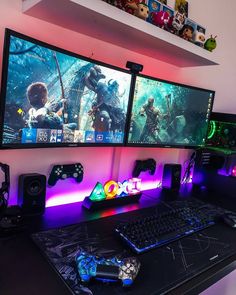 three computer monitors sitting next to each other on top of a black desk with gaming accessories