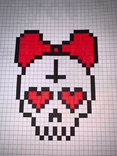 a skull made out of legos with red bows and hearts on it's head