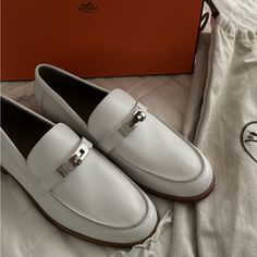 Never Worn, Mint Condition, 100% Authentic. Purchased Directly From Hermes Boutique. Women’s 37. Beautiful Destin Loafers With Kelly Buckle. White With Silver Hardware. Rare Find. Comes With Dust Bags And Original Protective Packaging Hermes Boutique, White Dress Shoes Men, Galaxy Stuff, Blue Leather Sandals, White Loafers, Black Suede Flats, Loafers Women, Leather Loafers Women, White Dress Shoes