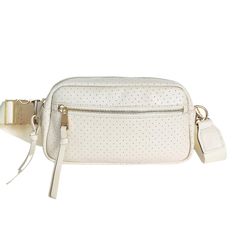 Whether you're walking around town, at a sporting event, or out to dinner, the Hampton is perfect for when you want to be hands-free. It fits all your essentials and has an adjustable strap to go from crossbody to waist bag for two looks in one! HIGHLIGHTS Shell ivory Luxury genuine perforated leather  9.5" W X 5.5" H X 2.5" D Shore Pine green lining Custom gold hardware with solid metal buckle Exterior front pocket: perfect for your phone or keys Interior card slot Interior leather trimmed pock Sporting Event, Pine Green, Perforated Leather, Charm Set, Solid Metal, Ring Collections, Waist Bag, Metal Buckles, Stainless Steel Bracelet