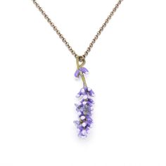 MICHAEL MICHAUD LAVENDER PENDANT 9320 Lavender is a stunning member of many herb gardens and showcases its sweeping drifts of purple hue from early summer into fall. With its silvery-green foliage, upright flower spikes and lovely, fragrant aroma, lavender makes for the perfect addition to floral bouquets and arrangements. Lavender is valued for its healing properties, which can often be found in soaps and oils. Materials: The Lavender pendant is cast in bronze with a hand patina finish and acce