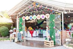 an outdoor birthday party with tables and chairs