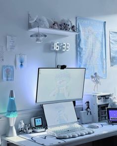 a desk with a computer monitor, keyboard and mouse on it in a white room