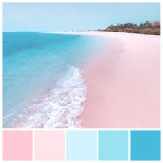 a beach with blue, pink and white water