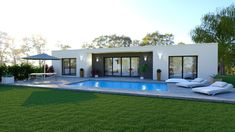 a house with a swimming pool and lounge chairs