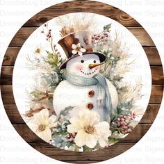 a snowman wearing a top hat and scarf with white flowers in front of a wooden background