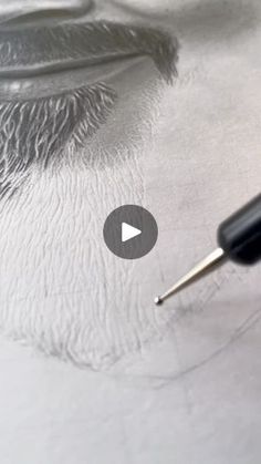 an eye is shown with a pen in it