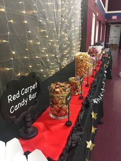 candy bar set up with red carpeted candy bar sign and star shaped candies