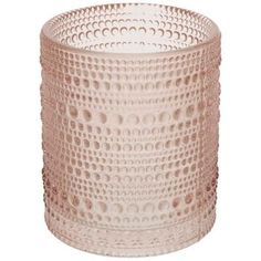 a pink glass vase with holes on it