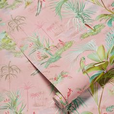 a pink wallpaper with tropical leaves and birds on it's back ground,