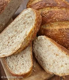 several loaves of bread on a cutting board