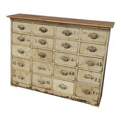 an old dresser with many drawers and knobs on the doors is isolated against a white background