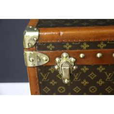 an old louis vuitton trunk with studded handles