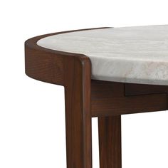 a marble top table with wooden legs