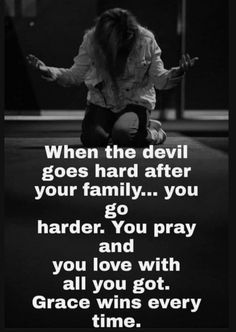 a woman kneeling down with her arms spread out in front of her and the words when the devil goes hard after your family you go harder