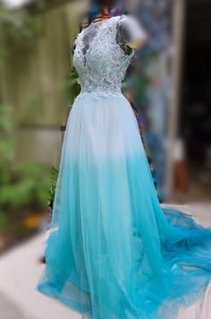 a blue and white dress sitting on top of a table