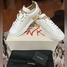 White Leather Sneaker W/Gold Logo. Never Been Worn. Size Little Too Small For Me. Cute For Travel, Errand Runs Etc. Full Inclusions. Box/Shoe Bag Luxury White Sneakers With Contrast Sole, White Luxury Low-top Sneakers, Designer White Leather Custom Sneakers, Elegant Low-top Custom Sneakers, Luxury White Sneakers, Luxury White Sneakers For Sneaker Matching, Luxury White Custom Sneakers With Contrast Sole, Luxury Custom White Sneakers, Elegant White Leather Sneakers