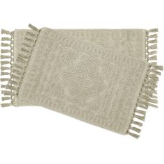 two white towels with fringes on the bottom and one has an intricate design in it