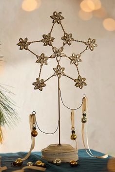 a christmas tree decoration with bells and decorations