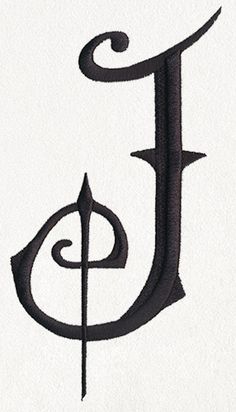 the letter j is made up of black ink and has an ornate design on it