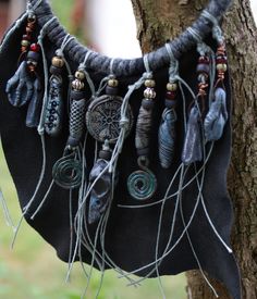 Organic tribal, pagan necklace with a lot of shamanic amulet porcelain beads, bird skull, Helm of Awe (made by me) - based on a black leather. Total length of this necklace is c/a 50 cm. Witchy Beaded Jewelry, Shaman Clothing, Shaman Necklace, Florida Jewelry, Organic Necklace, Helm Of Awe, Pagan Necklace, Rustic Necklace, Porcelain Beads