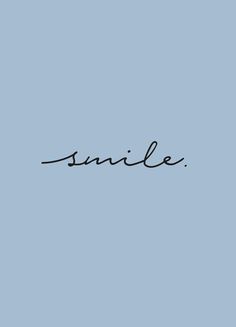 the word smile written in cursive writing on a blue background with black ink