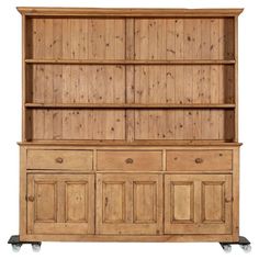 a wooden cabinet with wheels and drawers on the bottom, in front of a white background