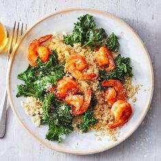 a white plate topped with rice and shrimp