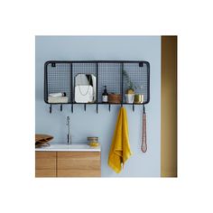 a kitchen with a sink, towel rack and hanging utensils