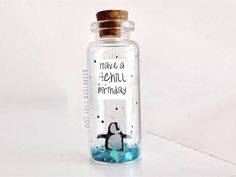 there is a bottle with a penguin in it that says, have a penguins birthday