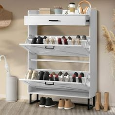 a white shoe rack filled with lots of shoes