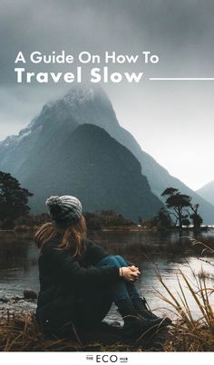 a woman sitting in front of a mountain with the words conquering homesickness