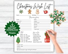 a christmas wish list with gingerbreads and other holiday decorations on it, next to a hand holding a pen