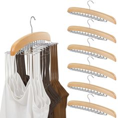 clothes hangers are hanging on the wall and next to them is a white shirt with wooden hangers