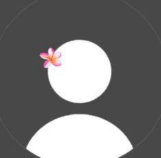 a white circle with a pink flower in the center