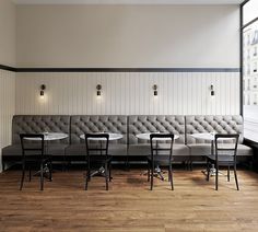 an empty restaurant with tables and chairs