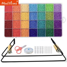 multicolored beads and scissors are on display in front of a white background with black handles