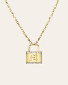 14k gold lock pendant with diamond embellishment hanging on a dainty gold chain with the option to add an engraving. Font choices are available in Block, Script, and Gothic. Please refer to our Font & Size Guide for examples. Diamond weight: approx. 0.03ctw Size: Approx. 15mm (H) 11mm(W) Standard Production: 5-10 business days Rush Order Production: 3-6 business days Shipping: Select shipping method at checkout. 2-Day Shipping and Overnight shipping available by request at checkout Shipped from Personalized 14k Gold Necklace With Rectangular Pendant, Elegant Personalized Adjustable Locket Necklace, Gold Lock Necklace As Gift, Luxury Lock Necklace As Gift, Gold Padlock Necklace, Lock Necklace, Disc Necklace, Wedding Wear, Lab Diamonds