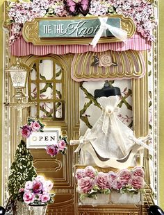 a card that has flowers and a dress on the front, with an image of a mannequin