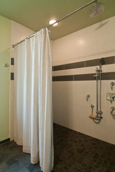 a bathroom with a shower, toilet and bathtub next to each other in it