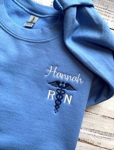 "Nurse Sweatshirt-Custom Embroidered Sweatshirt-Nurse Gift-RN Sweatshirt-Nursing Student-Nurse Shirt-Nursing Sweatshirt-Nurse Graduation Gift-NICU Nurse-Nurse in the Making Nurses are Super Heroes! They deserve this Custom Nurse Sweatshirt Crewneck Embroidered in your choice of sweatshirt colors and thread. This custom embroidered sweatshirt is super soft, unisex in size and makes a trendy sweatshirt to wear with pride! Also makes a wonderful nurse graduation gift or a gift for any present or fu Nursing Graduation Gift Ideas, Personality Change, Nurse Outfit Scrubs, Custom Embroidered Sweatshirt, Nursing Hoodie, Medical School Inspiration, Nursing Accessories, Nursing Student Gifts, Sewing Business