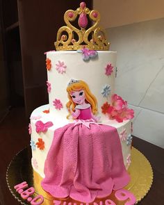 a birthday cake with a princess on top